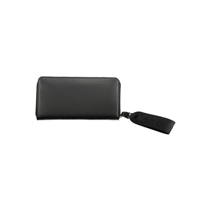 Calvin Klein Black Polyethylene Wallet with zip closure and removable pull, featuring 5 compartments, coin purse, and card spaces.