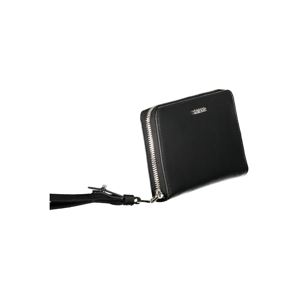 Calvin Klein Black Polyethylene Wallet with zip closure, 5 compartments, card slots, and logo.