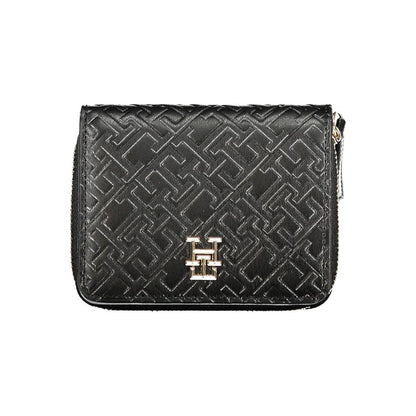 Tommy Hilfiger Black Polyethylene Wallet featuring coin purse, double card spaces, contrasting details, zip and automatic closure.