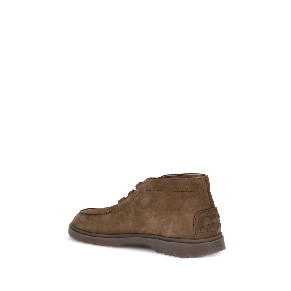 Tod's Brown Calf Leather Bos Taurus Lace-Up Boots side view with embossed logo and rubber pebbles on the heel.
