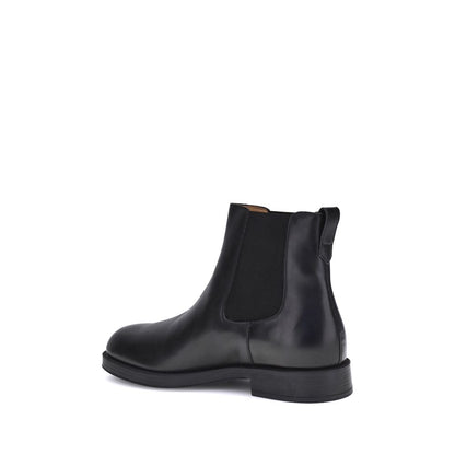 Tod's Black Calf Leather Bos Taurus Chelsea Boots with matte finish and elastic side