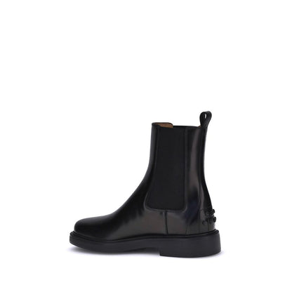Tod's Black Calf Leather Bos Taurus Chelsea Boots with side elastic inserts and rubber sole for comfort and grip.