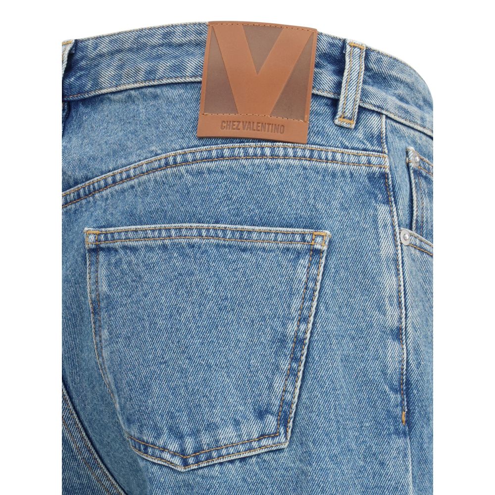 Close-up of Valentino Blue Cotton Straight-Leg Jeans with logoed leather patch highlighting classic five-pocket design.