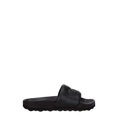 Off-White Black Leather Slippers with front logo and open toe design, featuring low flat heel and rubber sole, MPN OWIT001LEA0011010.