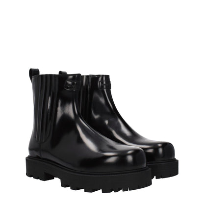 Givenchy Black Leather Ankle Boots with a round toe, mid heels, rubber sole, featuring front and back logos, style casual.