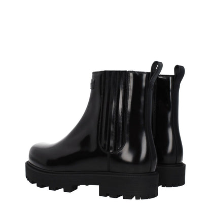 Alt Tag: Givenchy Black Leather Ankle Boots with logos, round toe, and mid heels. Features rubber sole and 4 cm heel height. Casual style.