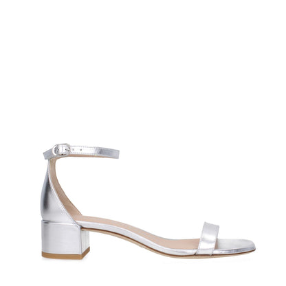 Stuart Weitzman Gray Leather Flat Sandals with buckle closure, open toe, and mid heels, side view; MPN: NUDISTCURVE35LIDSA535SILVER.