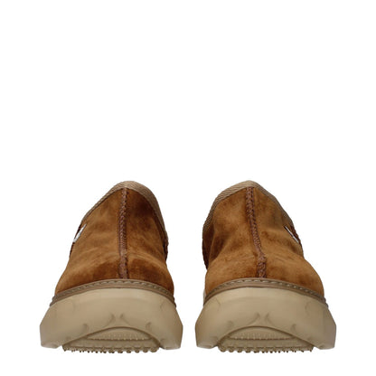Back view of Givenchy Brown Leather Slippers showcasing suede material and rubber sole.