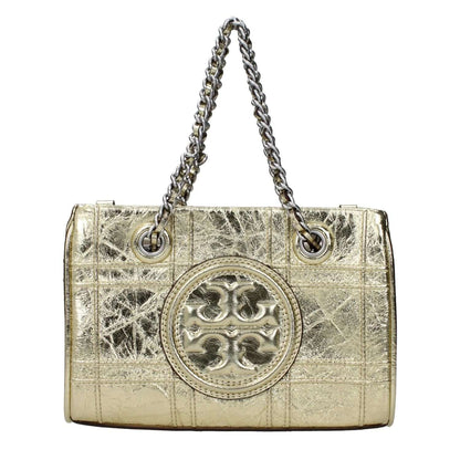 Tory Burch Gold Leather Handbag with front logo, adjustable and removable shoulder strap, metallic effect, and magnetic closure.