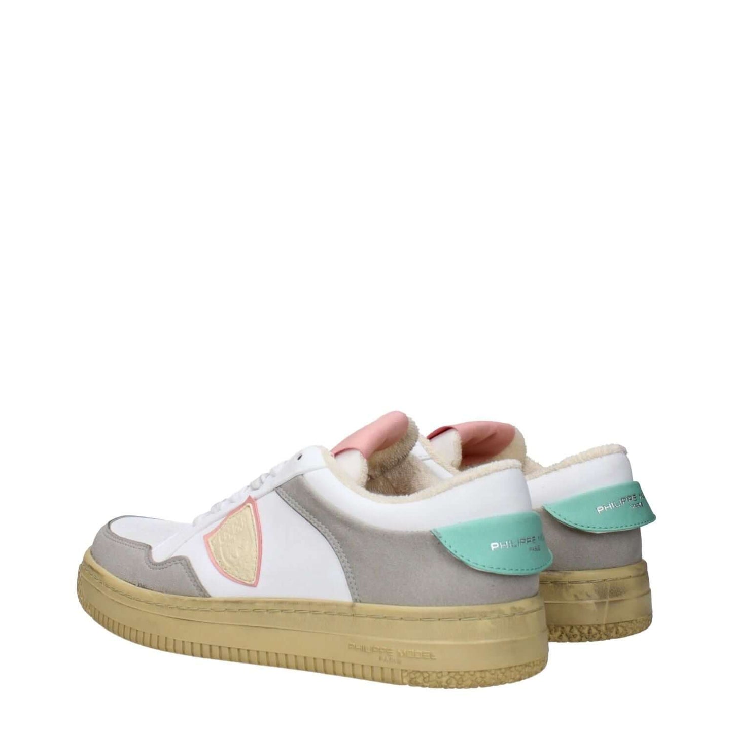 Philippe Model White Leather Low Top Sneakers with vintage and aged effect, teal accents, rubber sole, and lace-up closure, side view.
