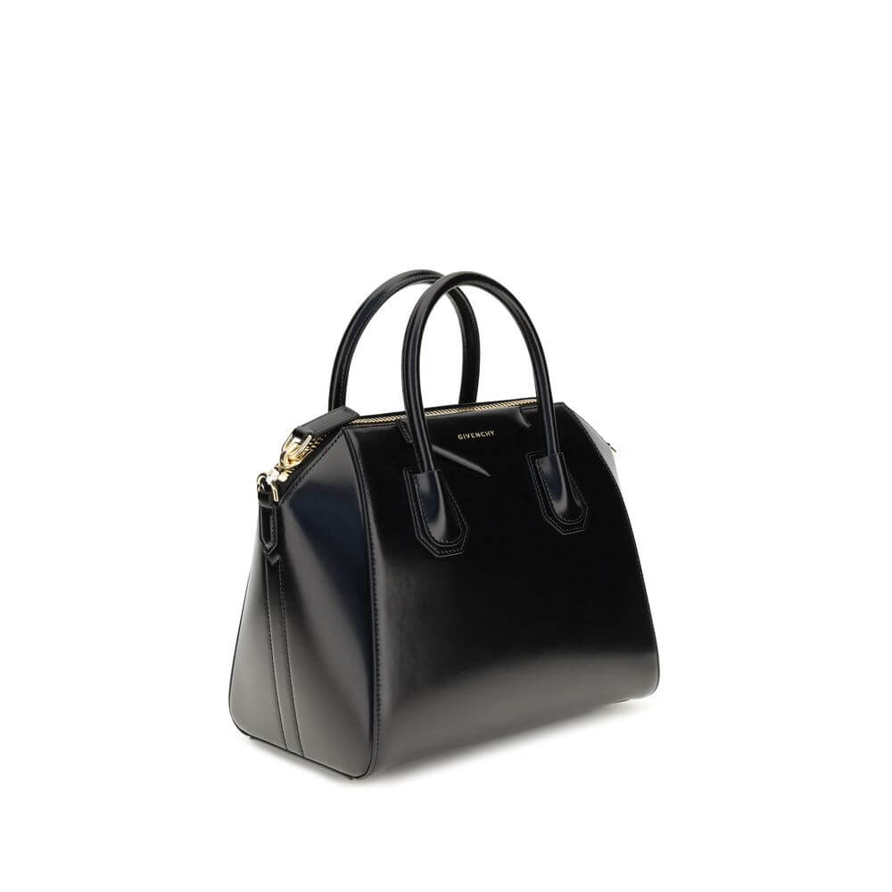Givenchy Black Calf Leather Bos Taurus Handbag with gold embossed logo and zipper closure.