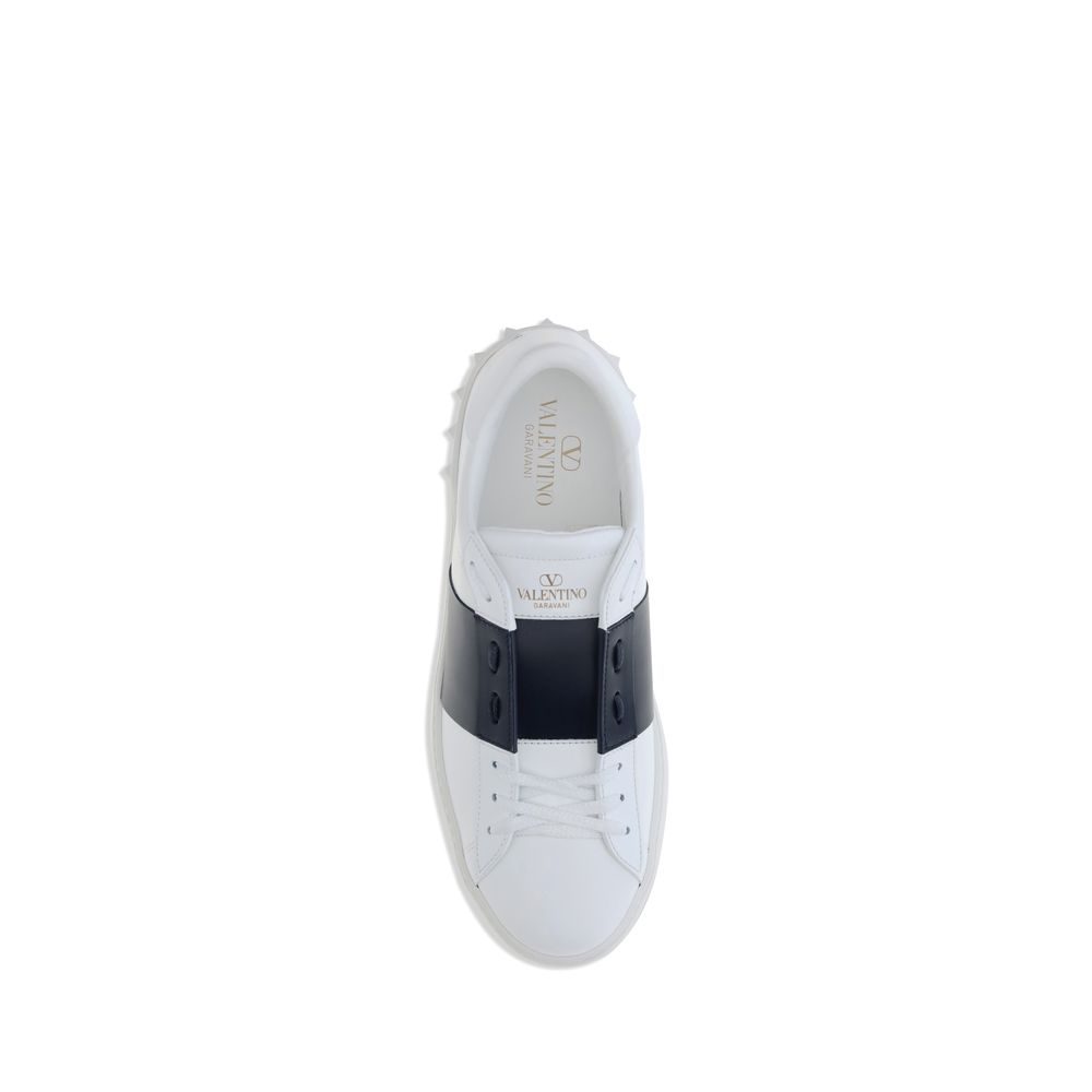 Valentino Garavani White Calf Leather Bos Taurus Low Top Sneakers with contrasting bands and studs on heel.