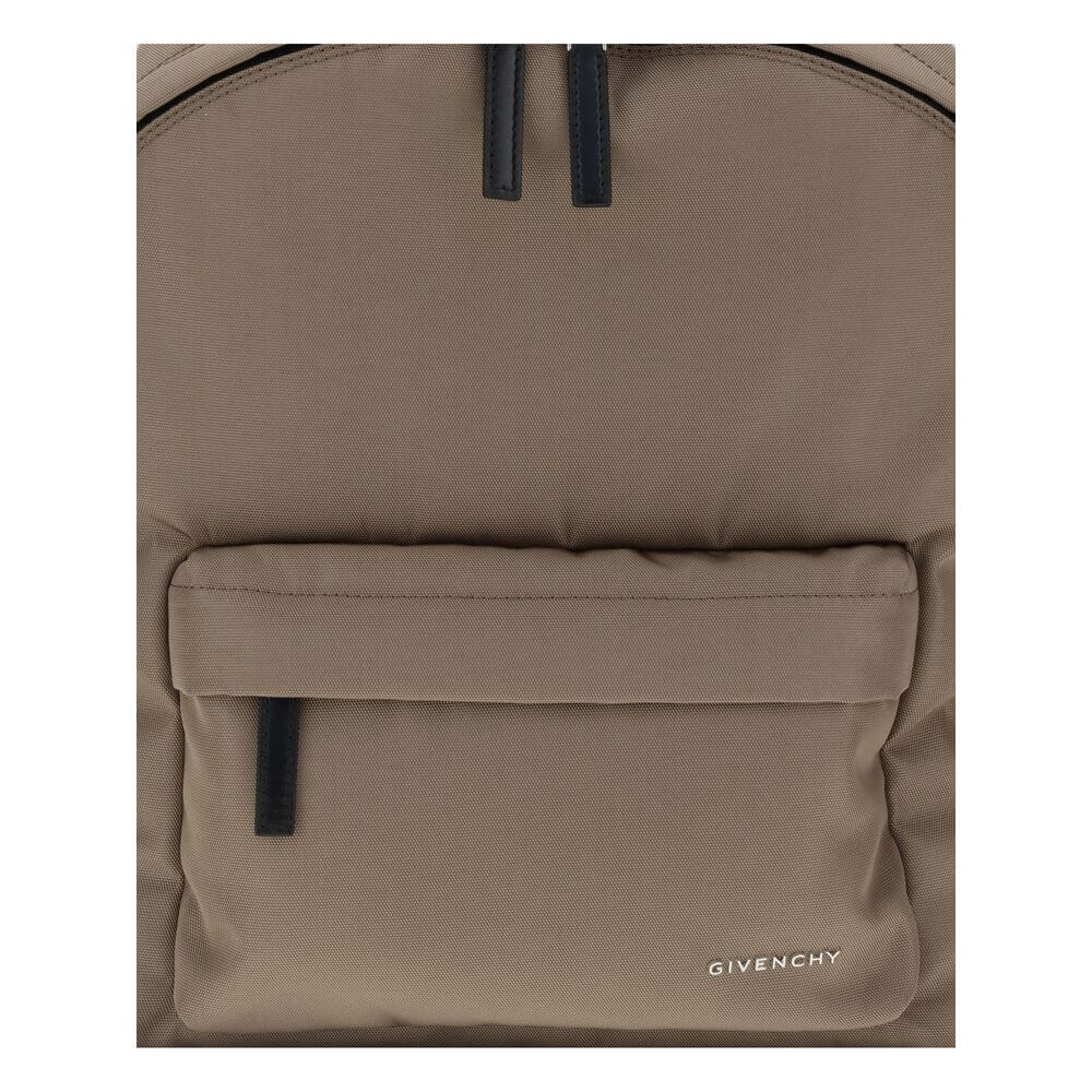 Givenchy Brown Polyamide Backpack with front pocket and metal signature, featuring double-zip closure and padded straps for style and functionality.