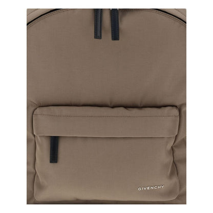 Givenchy Brown Polyamide Backpack with front pocket and metal signature, featuring double-zip closure and padded straps for style and functionality.