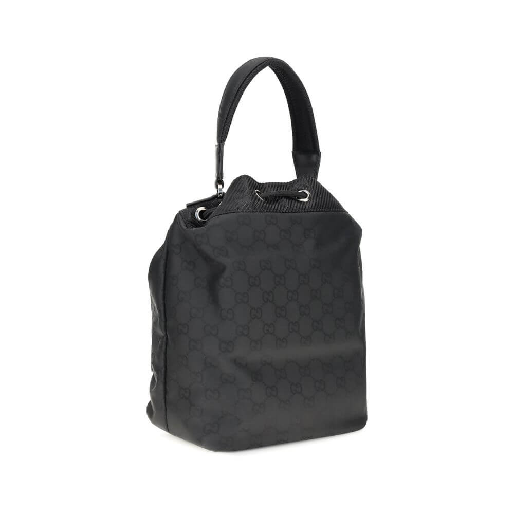 Gucci Black Polyamide Backet Bag with GG Supreme pattern, rigid handle, and drawstring closure, product for AW25 season.