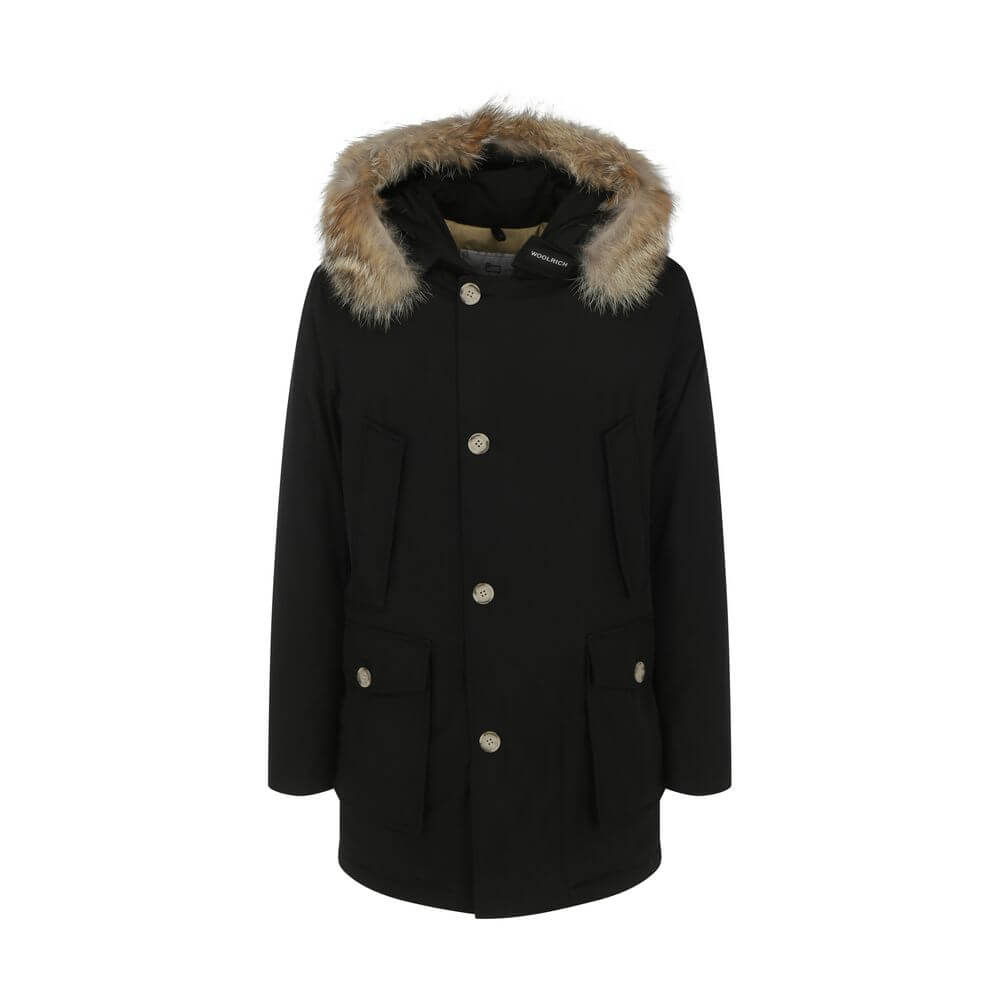 Woolrich Black Cotton Parka with fur hood, front zip and button closure, and patch pockets for AW25. Made in Bulgaria, 60% cotton, 40% polyamide.