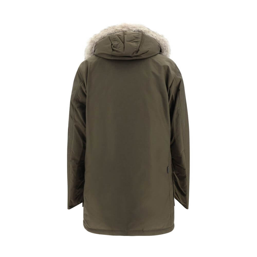 Back view of Woolrich Green Cotton Parka with fur-trimmed removable hood, showcasing oversized fit and padded design for AW25 season.