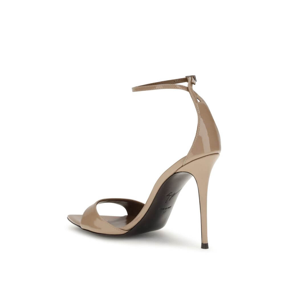 Giuseppe Zanotti Beige Leather Stiletto Heel Sandals with silver-tone strap and logo-embossed insole.