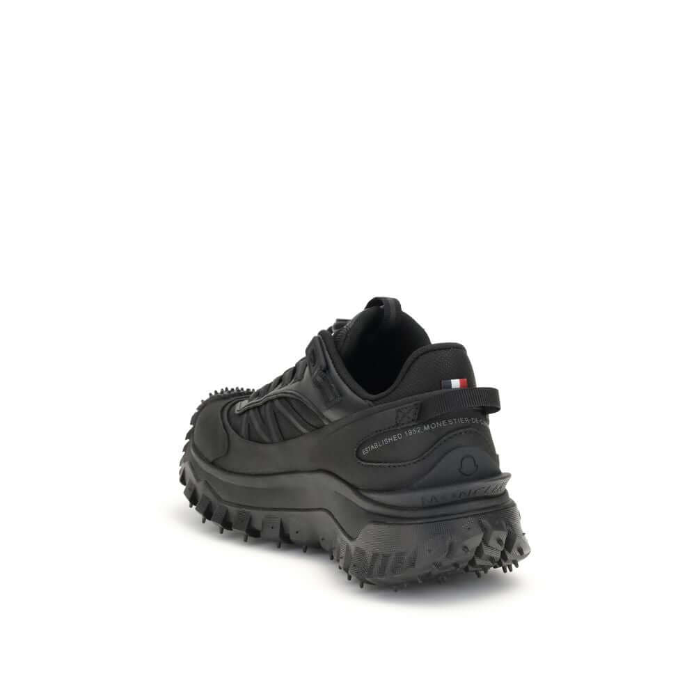 Rear view of Moncler Black Calf Leather Bos Taurus Athletic Sneakers showing logo print and rugged sole design.