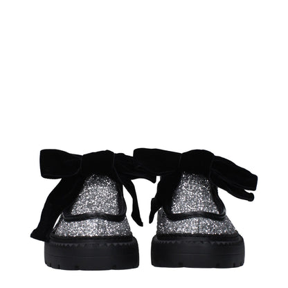 Jimmy Choo Gray Plastic Slip-On Loafers with glitter, black bows, and round toe design, featuring rubber sole and mid heels.