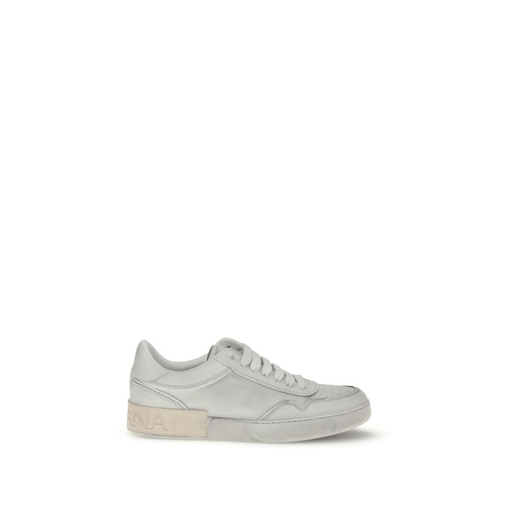 Dolce & Gabbana White Calf Leather Bos Taurus Low Top Sneakers with logo stripe and heel detail, round toe, lace-up front.