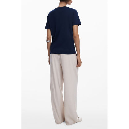 Back view of model wearing Desigual Blue Cotton Women T-Shirt with short sleeves and V-neck, showcasing chic and trendy fashion.