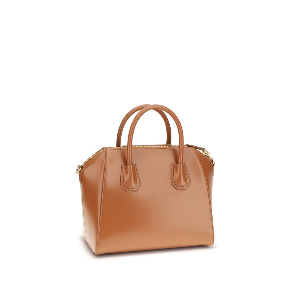 Givenchy Brown Calf Leather Bos Taurus Handbag with glossy finish, round handles, shoulder strap, and zipper closure.