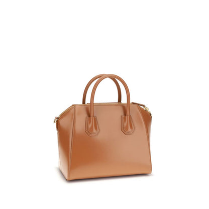 Givenchy Brown Calf Leather Bos Taurus Handbag with glossy finish, round handles, shoulder strap, and zipper closure.
