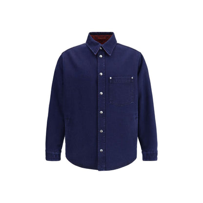 Gucci Blue Denim Shirt featuring reversible design, pointed collar, chest pocket, and Gucci metal buttons for elegant style.