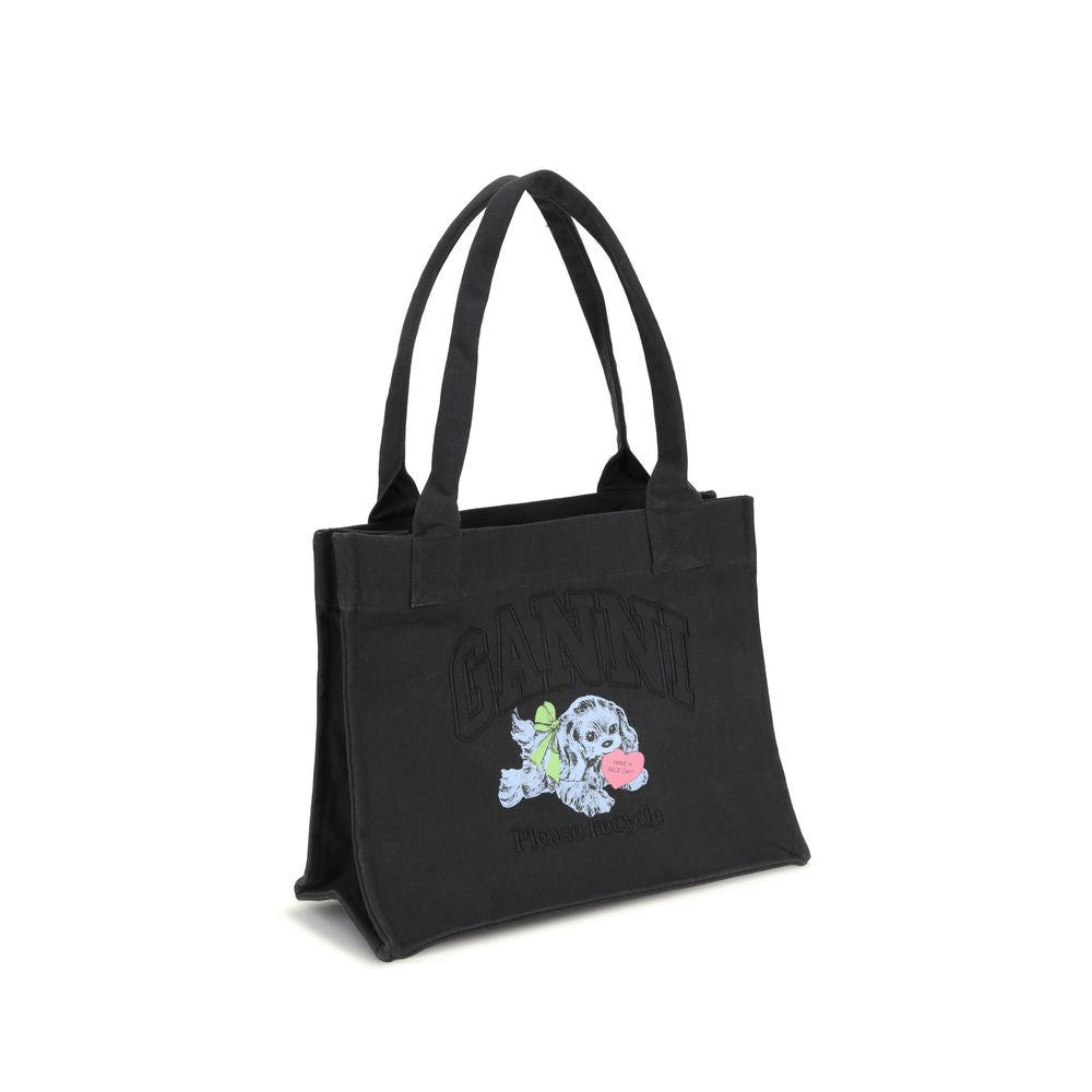 Ganni Black Cotton Shoulder Bag with puppy graphics, GANNI logo, and spacious interior, perfect for everyday use. Season AW25, 100% cotton.