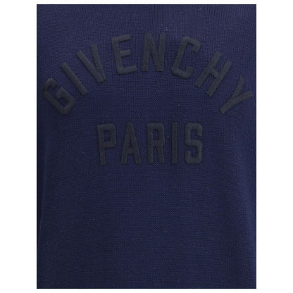 Close-up of black embroidered logo on Givenchy Blue Cotton Sweatshirt with high collar and ribbed hem, showcasing minimalist elegance.