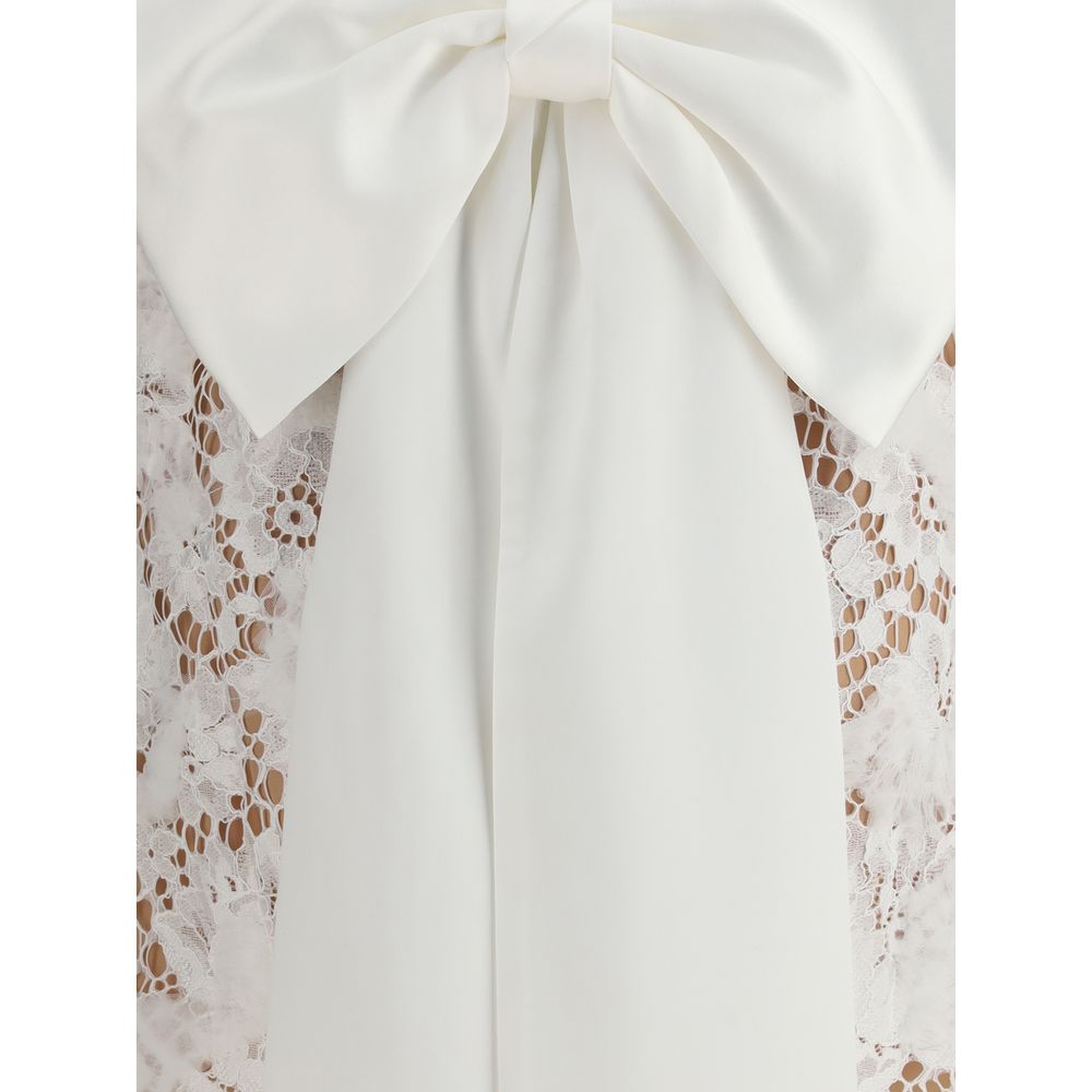 Self-Portrait White Nylon Casual Dress with oversized lace bow, highlighting the elegant back design and intricate detailing for AW25 collection.
