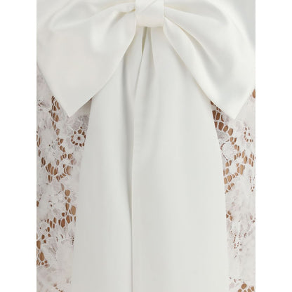 Self-Portrait White Nylon Casual Dress with oversized lace bow, highlighting the elegant back design and intricate detailing for AW25 collection.