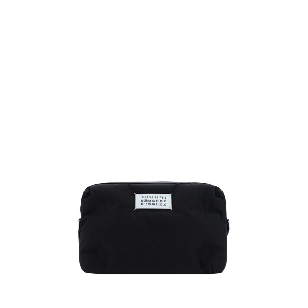 Margiela Black Nylon Shoulder Bag with leather inserts and adjustable strap, front logo, zipper closure, and back pocket. Dimensions 29x29x12.