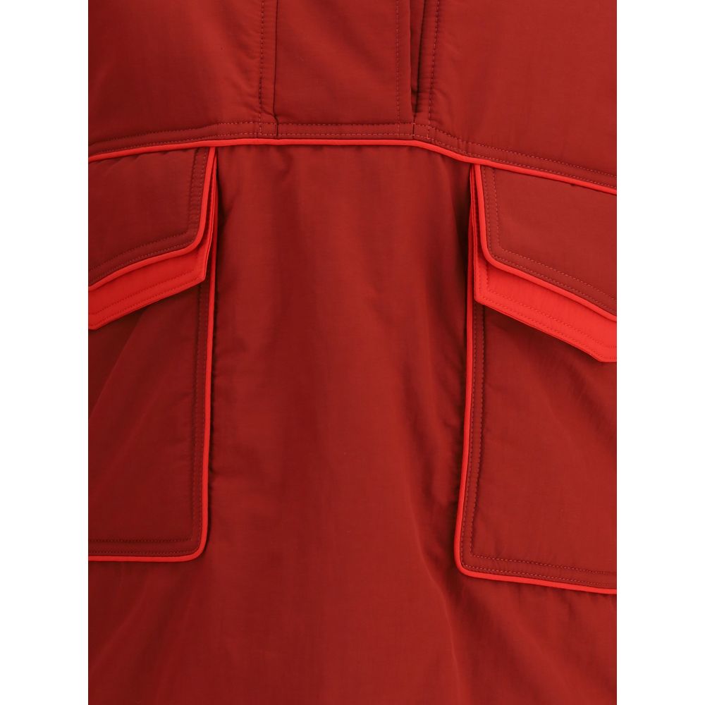 Close-up of MARBELL Red Polyamide Shell Jacket showing its front pockets and stitching details.