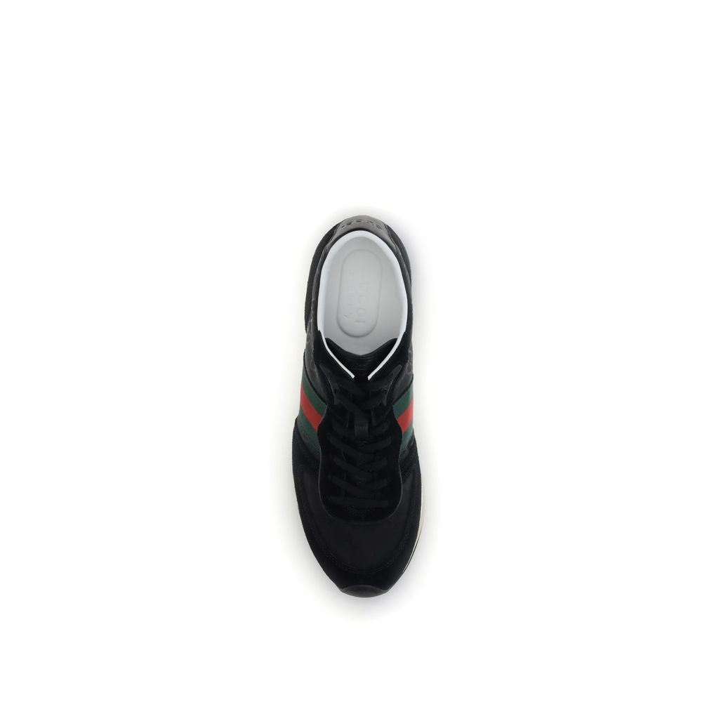 Top view of Gucci Black Polyamide Athletic Sneakers with green and red Web stripe and GG logo on rubber sole.
