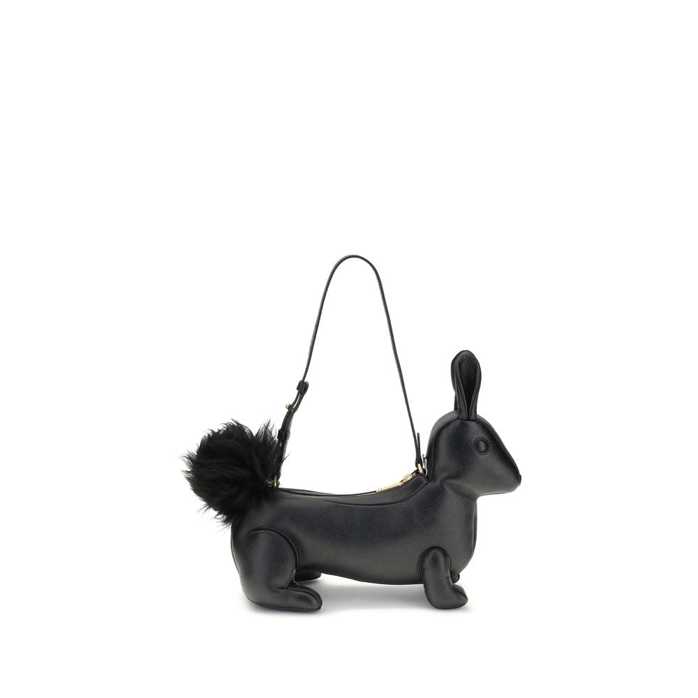 Thom Browne Black Calf Leather Bos Taurus Shoulder Bag with rabbit shape and fur tail, featuring brass zipper and adjustable strap.