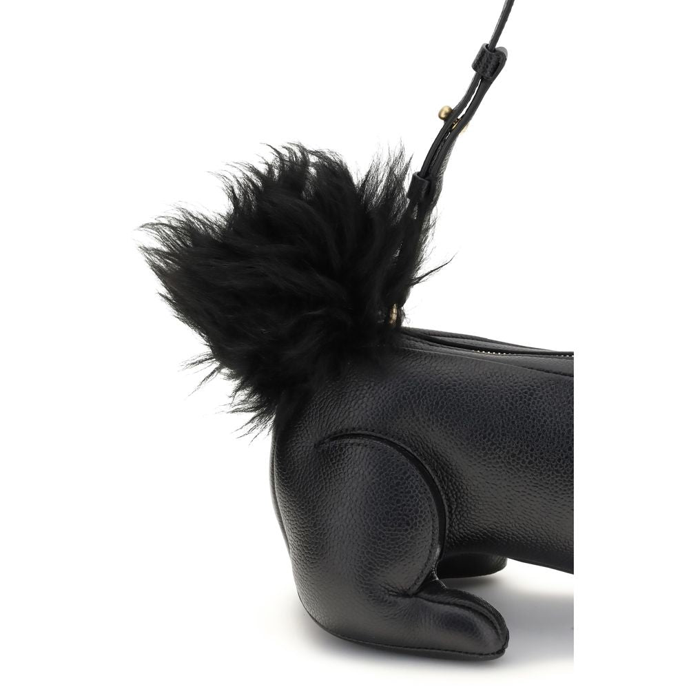 Close-up of Thom Browne Black Calf Leather Bos Taurus Shoulder Bag with fur tail and adjustable strap.