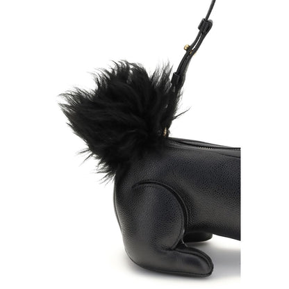 Close-up of Thom Browne Black Calf Leather Bos Taurus Shoulder Bag with fur tail and adjustable strap.