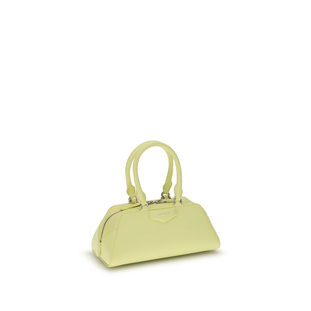 Givenchy Yellow Calf Leather Bos Taurus Handbag with structured design, articulated handles, and detachable strap.
