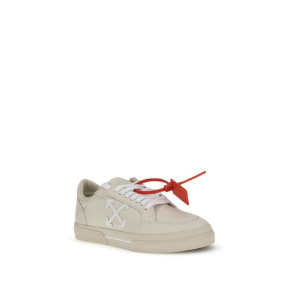 Off-White Beige Leather Low Top Sneakers with arrow motif and red zip tie tag on vulcanized rubber sole.