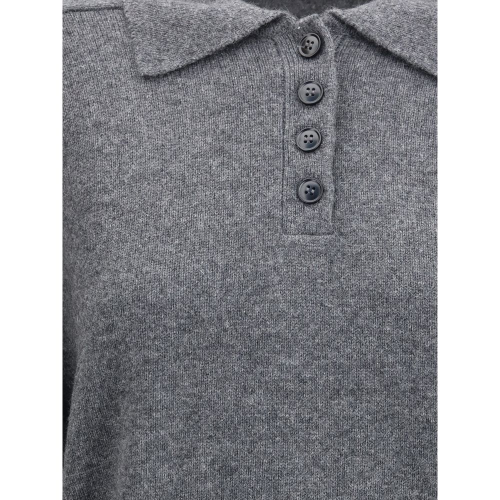 Close-up of Loulou De Saison Gray Cashmere Cashmere Sweater with ribbed collar and button closure, showcasing elegance and comfort.