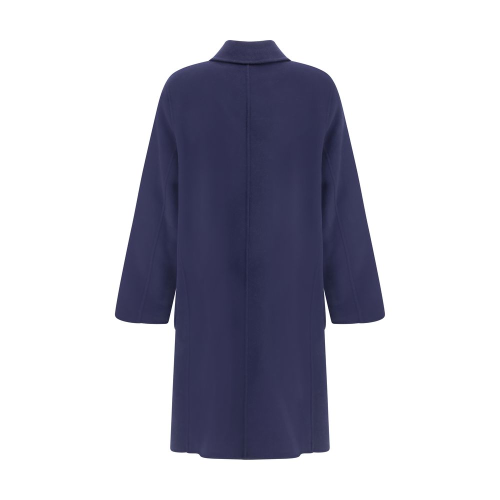 Back view of Tory Burch Blue Wool Coat with reversible design and T Monogram pattern, featuring an oversize fit for AW25.