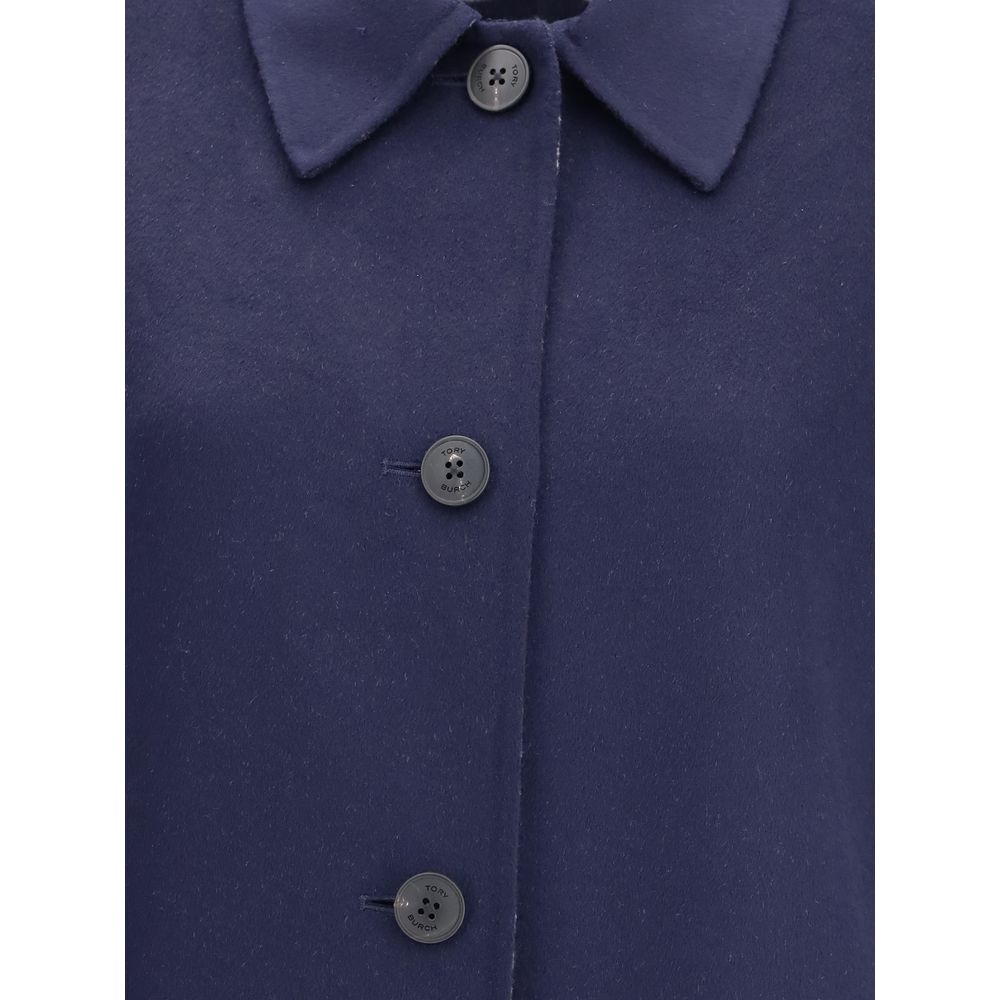 Close-up of Tory Burch Blue Wool Coat featuring button closure and soft wool texture, ideal for layering with a relaxed fit.
