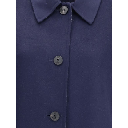 Close-up of Tory Burch Blue Wool Coat featuring button closure and soft wool texture, ideal for layering with a relaxed fit.