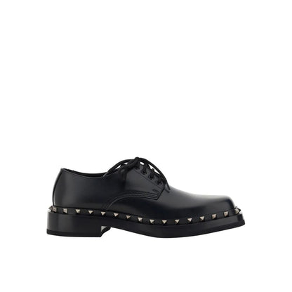 Valentino Garavani Black Calfskin Oxfords And Derbies with studs and lace-up closure.