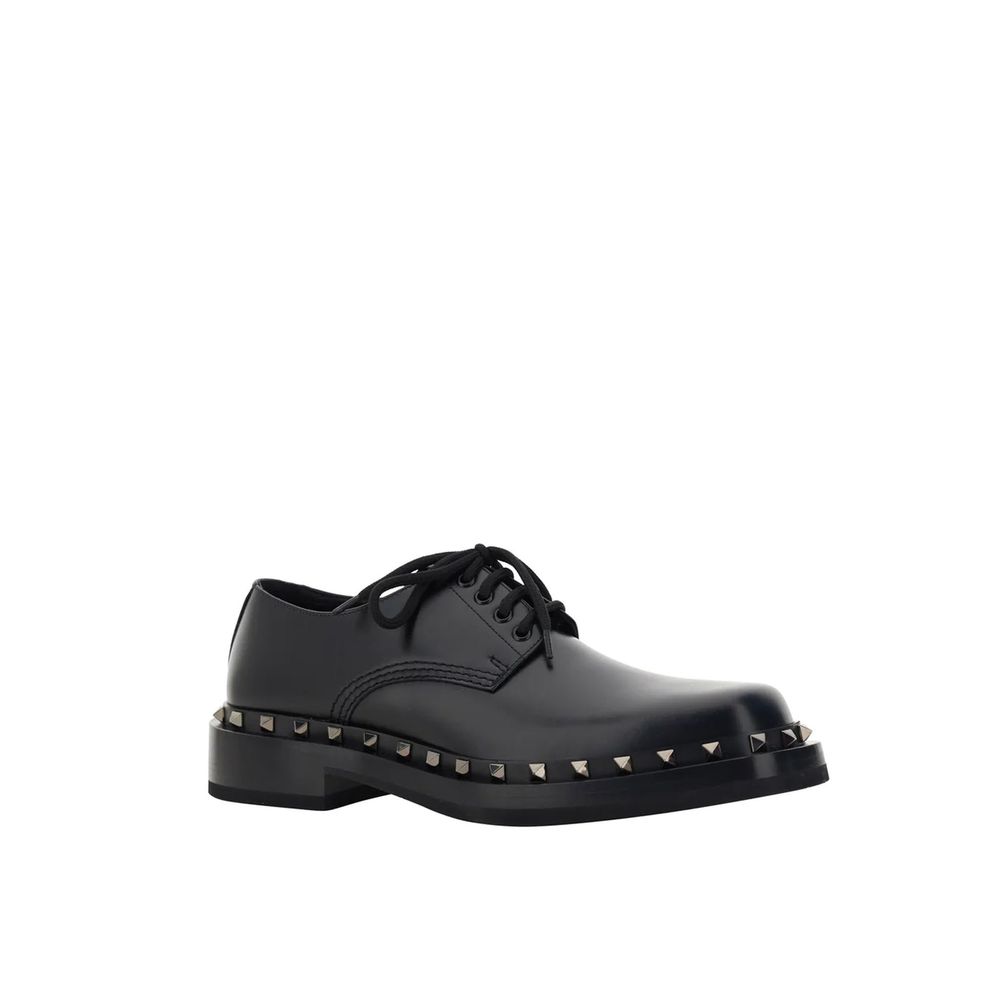Valentino Garavani Black Calfskin Oxfords And Derbies, men's leather shoes with round toe and stud detail, front lace-up, made in Italy.