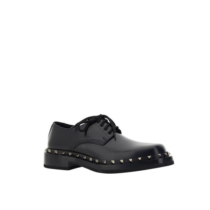 Valentino Garavani Black Calfskin Oxfords And Derbies, men's leather shoes with round toe and stud detail, front lace-up, made in Italy.