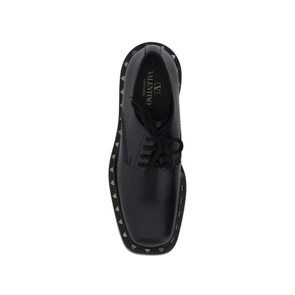 Valentino Garavani Black Calfskin Oxfords And Derbies, top view showcasing leather composition, lace-up design, and stud details.