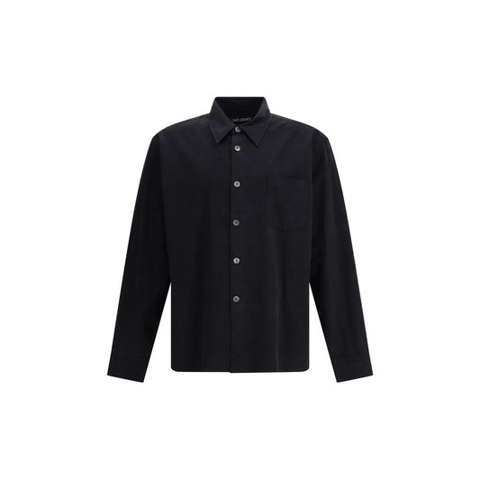 Our Legacy Black Cotton Dress Shirt crafted from Chinese poplin with pearl buttons and curved hem, AW25, 40% cotton, 60% lyocell.